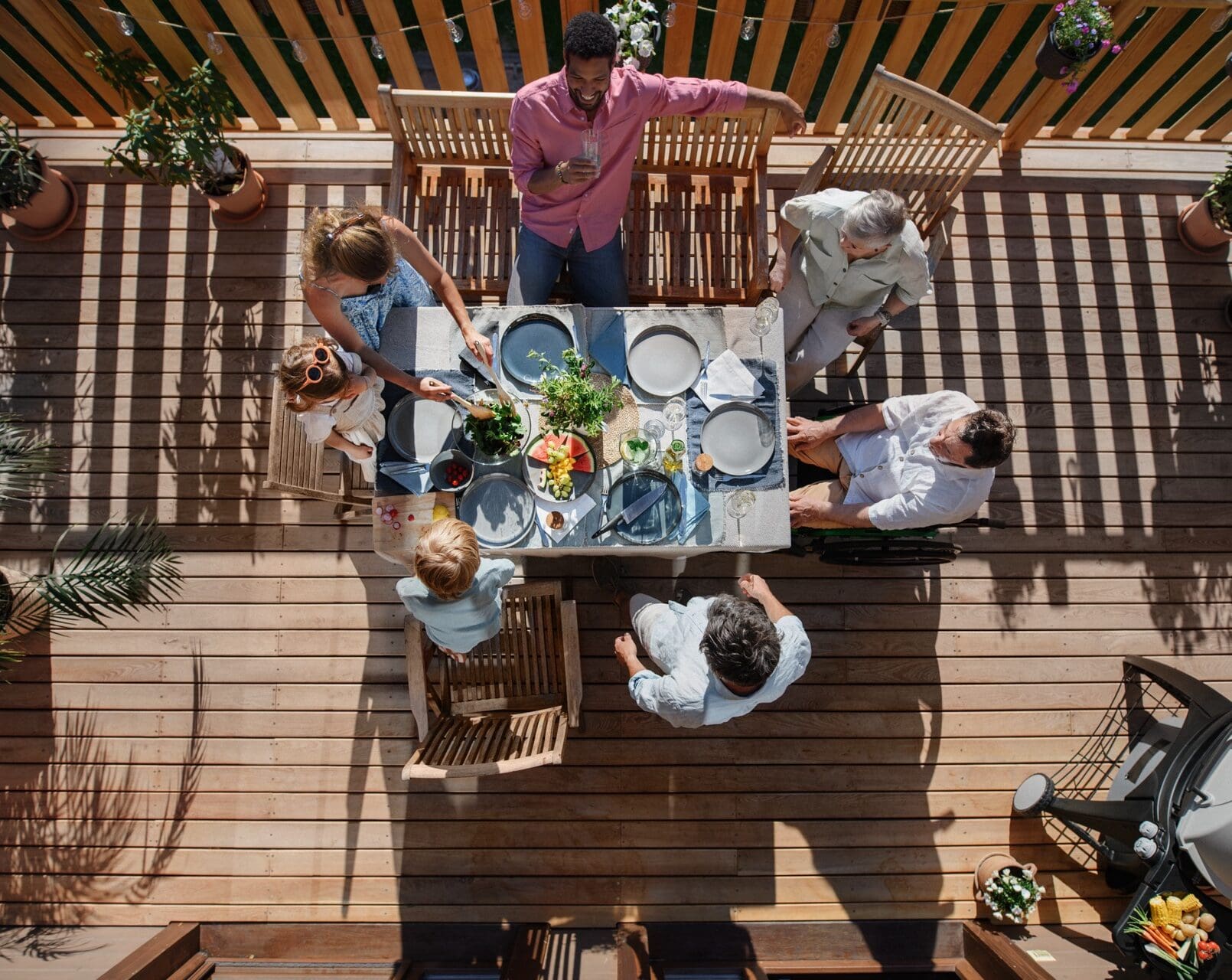 family enjoying new deck from reinert brothers construction